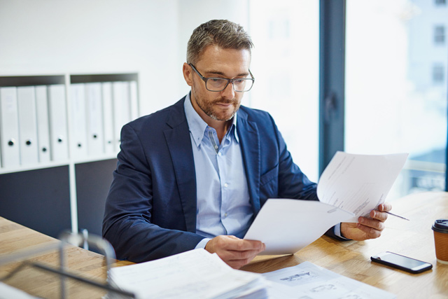 Business owner looking over paperwork